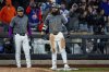 New York Mets' Jesse Winker, right, celebrates on third base after hitting a triple during the eighth inning of a baseball game against the Toronto Blue Jays, Saturday, April 5, 2025, in New York. (AP Photo/Angelina Katsanis)