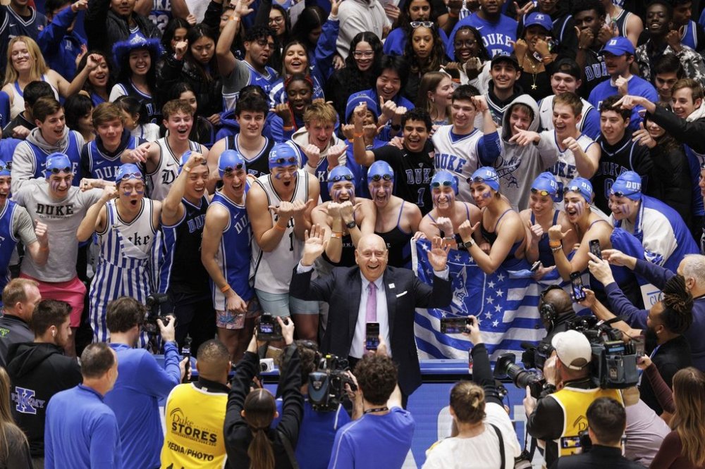 ESPN college basketball broadcaster Dick Vitale stands for a photo in front of the Cameron Crazies before an NCAA college basketball game between Duke and Stanford in Durham, N.C., Saturday, Feb. 15, 2025. (AP Photo/Ben McKeown)