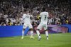 Real Madrid's Endrick, left, and Vinicius Junior celebrate after scoring during the Spanish Copa del Rey semifinal second leg soccer match between Real Madrid and and Real Sociedad in Madrid, Spain Tuesday, April 1, 2025. (AP Photo/Bernat Armangue)
