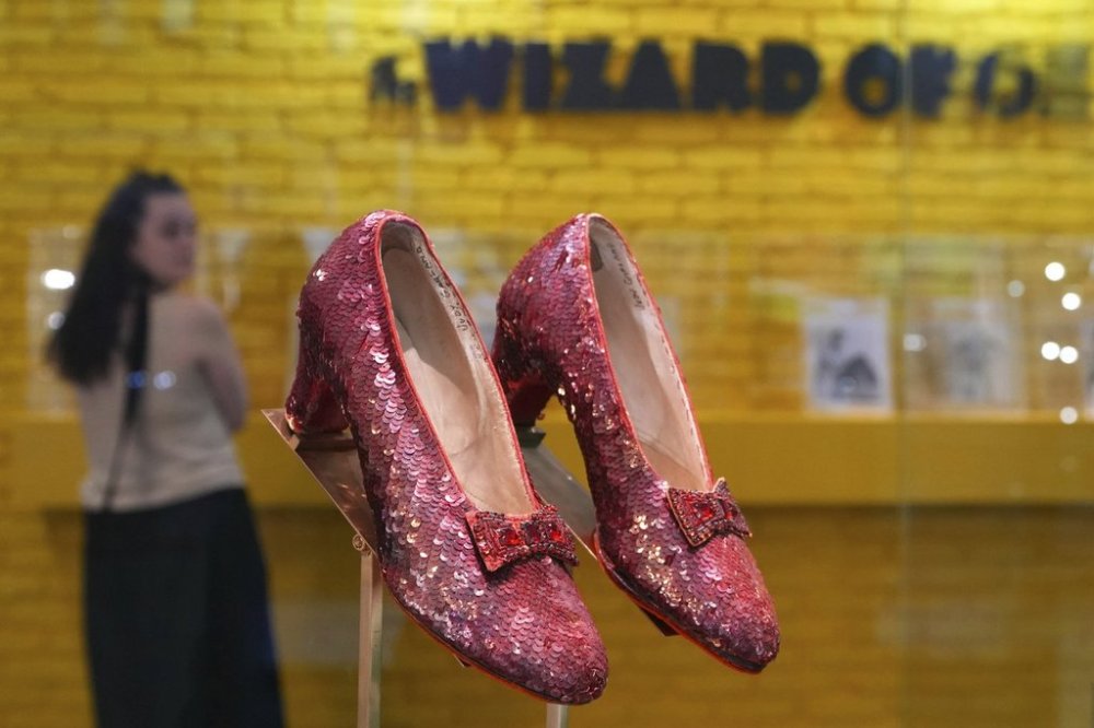 FILE - The original ruby slippers worn by Judy Garland in the classic 1939 film The Wizard of Oz are displayed in London ahead of being offered for auction on Dec. 7, at Heritage Auctions in the US, Wednesday, Nov. 27, 2024. (AP Photo/Kirsty Wigglesworth, file)