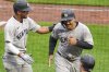 New York Yankees' Trent Grisham, right, celebrates with Oswald Peraza, left, after hitting a 3-run home run off Pittsburgh Pirates starting pitcher Bailey Falter during the fifth inning of a baseball game in Pittsburgh, Saturday, April 5, 2025. (AP Photo/Gene J. Puskar)