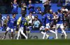 Everton's Iliman Ndiaye, left, celebrates scoring their side's first goal of the game during the English Premier League soccer match between Everton and Arsenal at Goodison Park, Liverpool, England, Saturday, April 5, 2025. (Martin Rickett/PA via AP)