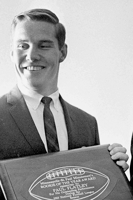 FILE - Minnesota Vikings Paul Flatley holds a plaque on June 22, 1964 in St. Paul, Minn. (AP Photo/Gene Herrick, File)