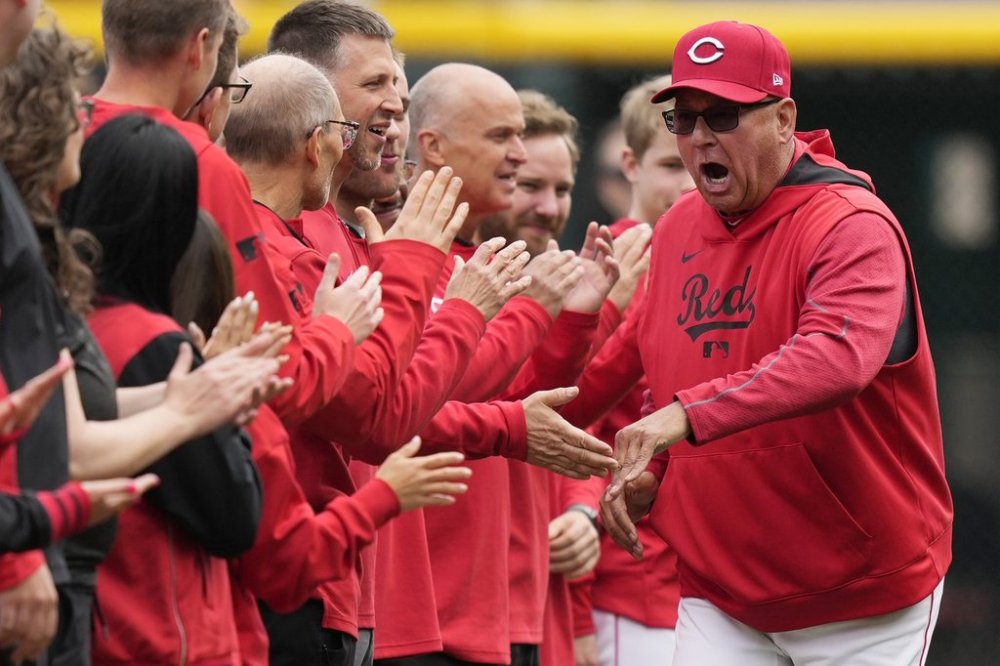 CORRECTS DATE - Cincinnati Reds manager Terry Francona greets players and staff on the field as he is introduced before an opening-day baseball game against the San Francisco Giants, Thursday, March, 27, 2025, in Cincinnati. (AP Photo/Carolyn Kaster)