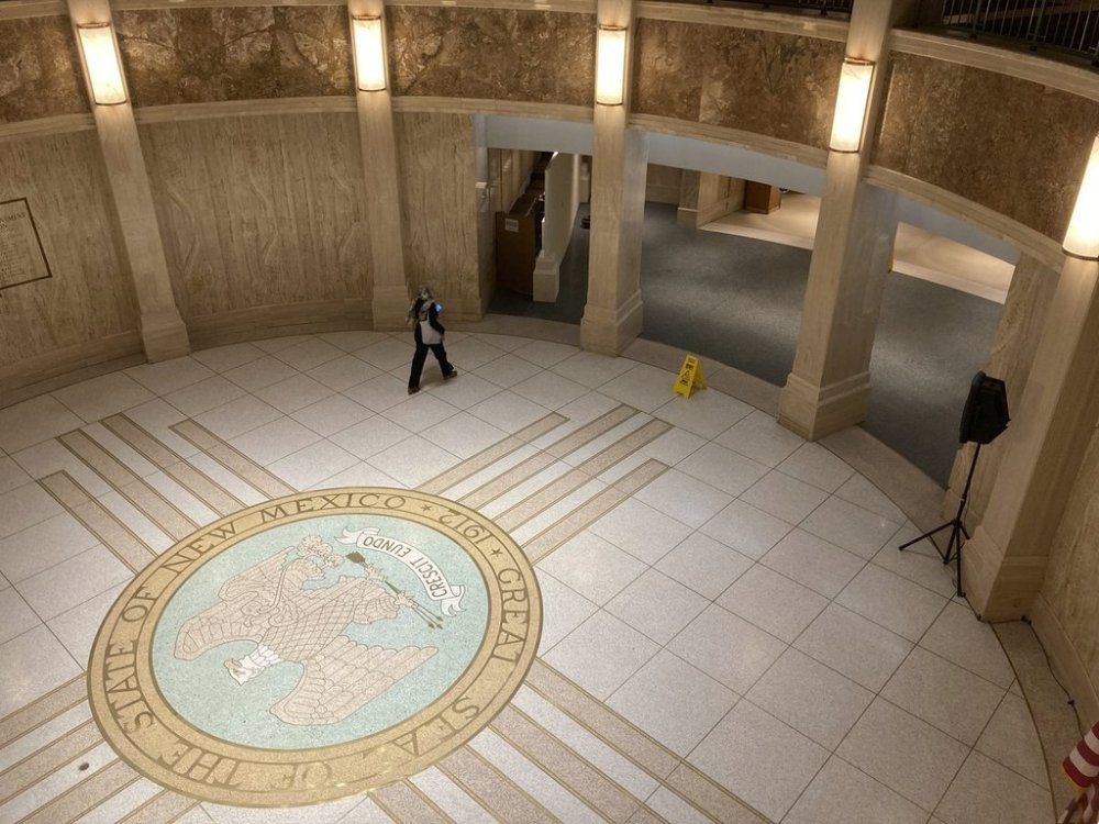 FILE - A pedestrian traverses the rotunda inside the New Mexico Capitol, March 16, 2023, in Santa Fe, N.M. (AP Photo/Morgan Lee, File)