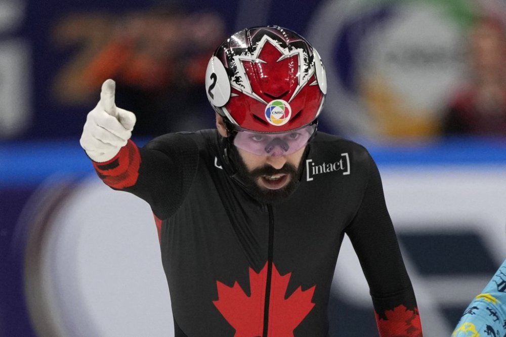 Canada's Steven Dubois celebrates as he crosses the finish line to win the Men 500m Final A Short Track Speed Skating in the ISU World Short Track Championships Beijing, China on Saturday, March 15, 2025. THE CANADIAN PRESS/AP-Ng Han Guan