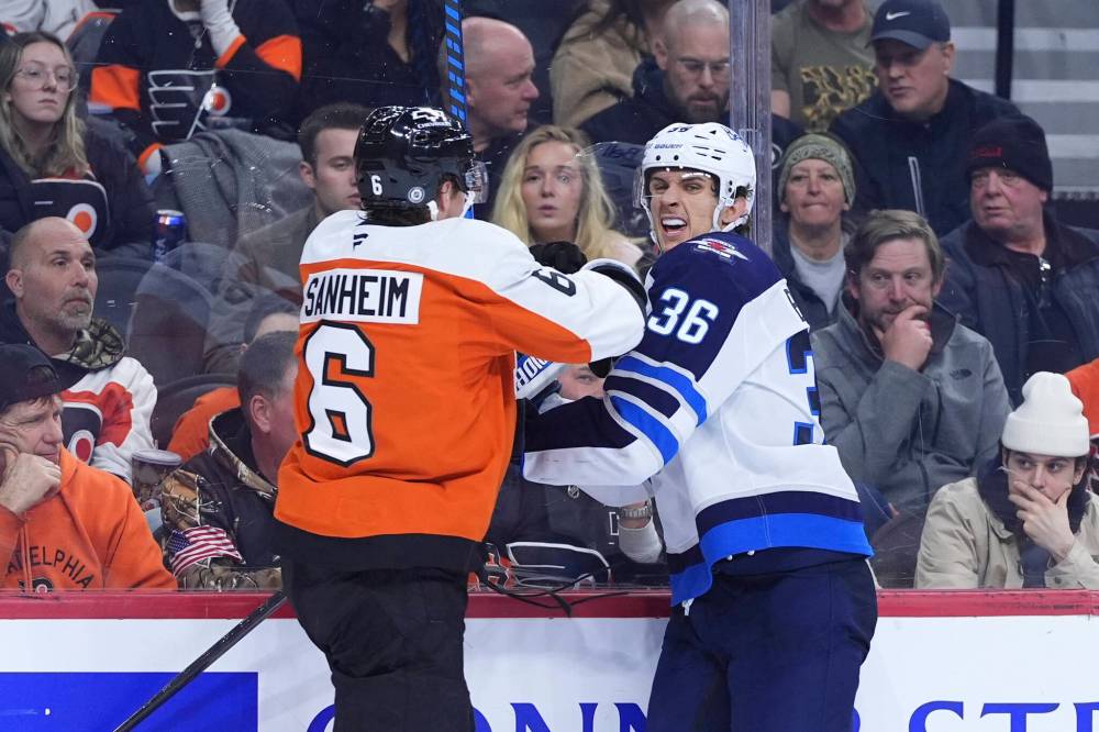 Matt Slocum / The Associated Press
Winnipeg Jets’ Morgan Barron and Philadelphia Flyers’ Travis Sanheim collide during the third period.