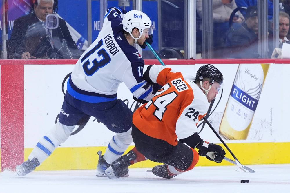 Matt Slocum / The Associated Press
Philadelphia Flyers’ Nick Seeler, right, and Winnipeg Jets’ Gabriel Vilardi battle for the puck during the third period.