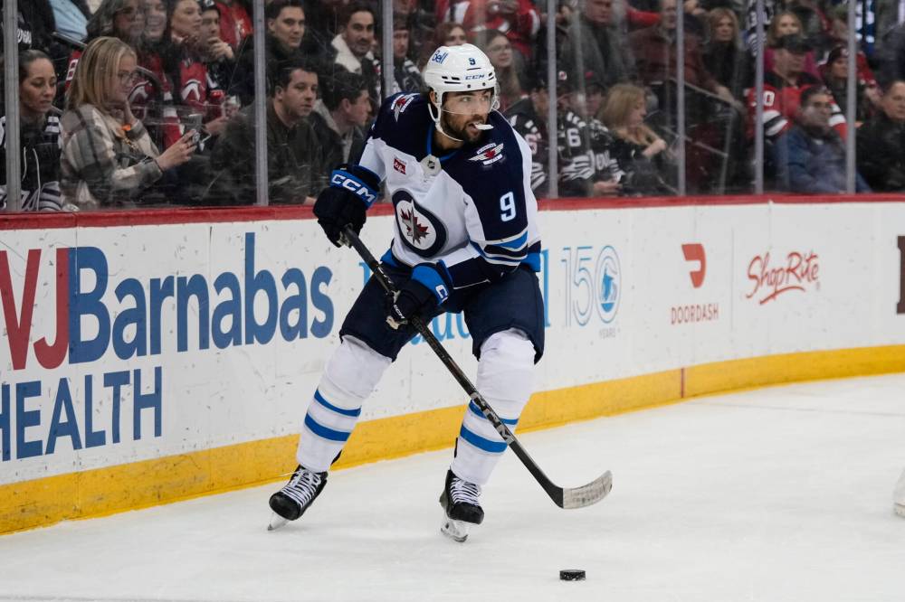 Frank Franklin II / The Associated Press
Winnipeg Jets’ Alex Iafallo looks to pass during the first period.