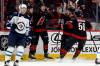 Carolina Hurricanes’ Mark Jankowski, center, celebrates with teammates after his goal against the Winnipeg Jets during the first period of an NHL hockey game in Raleigh, N.C., Sunday, March 9, 2025. (Karl DeBlaker / The Associated Press)