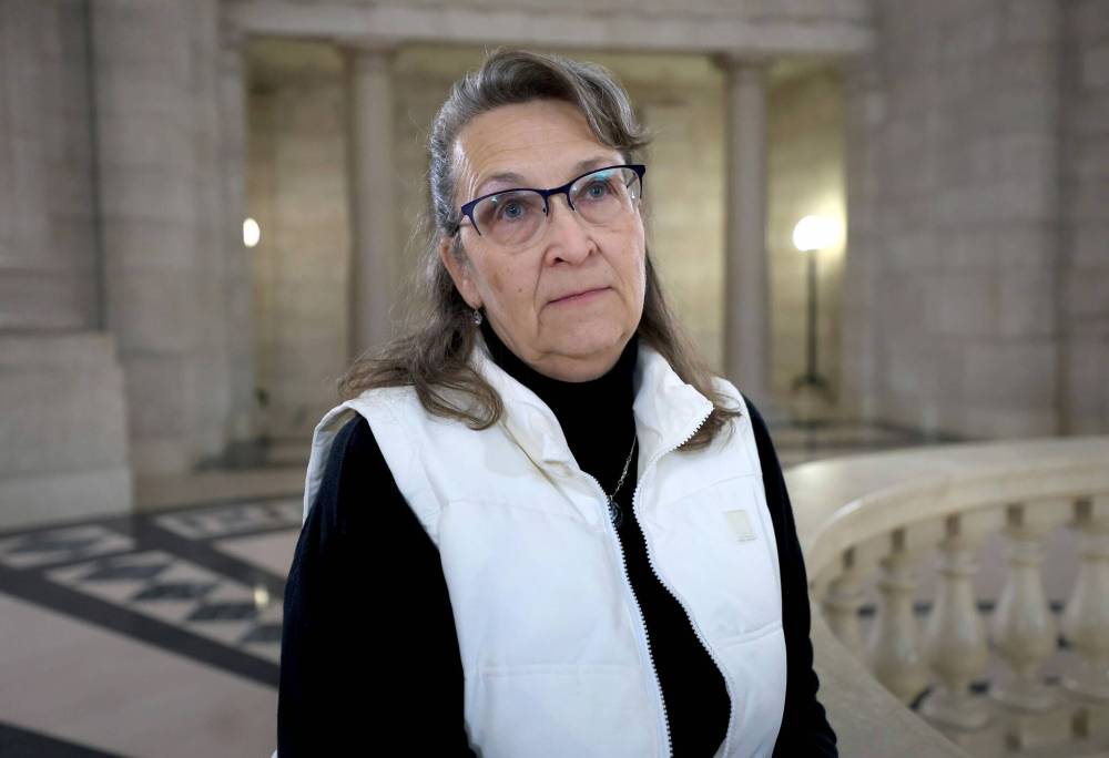RUTH BONNEVILLE / FREE PRESS
Mother of Kellie Verwey, Meechelle Best, talks to the media in the rotunda during a break in the question period session.