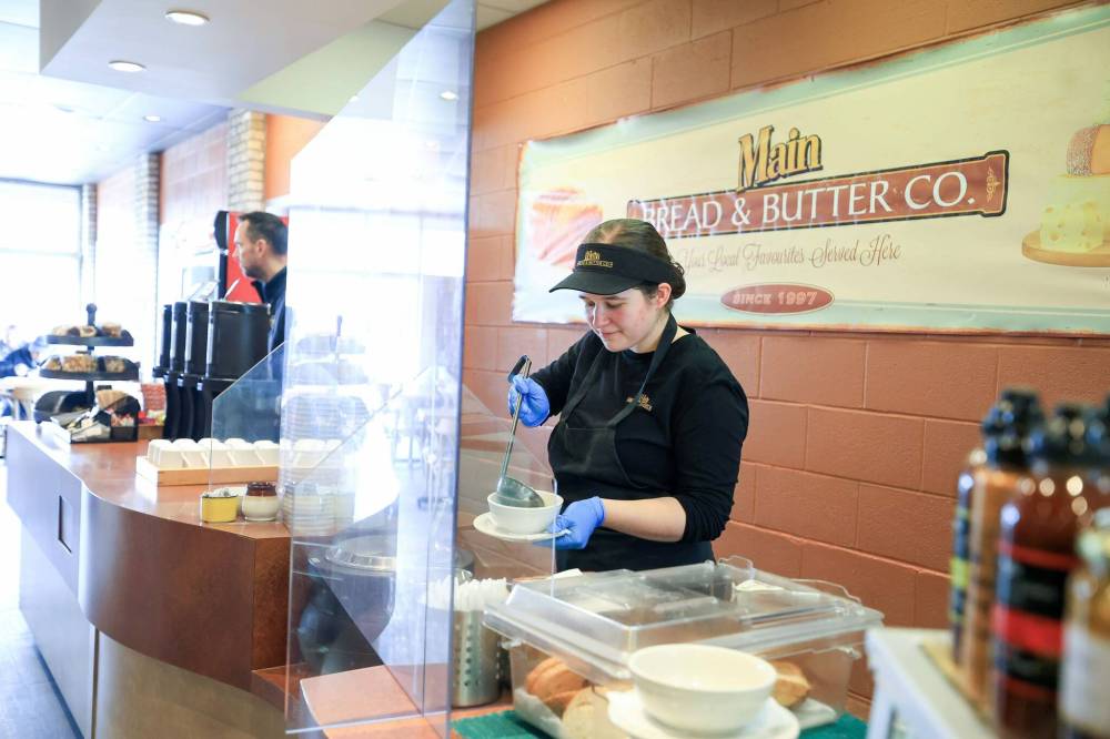 Emma Bullock serves up fresh soup to customers at Main Bread & Butter’s deli counter. (Ruth Bonneville / Free Press)