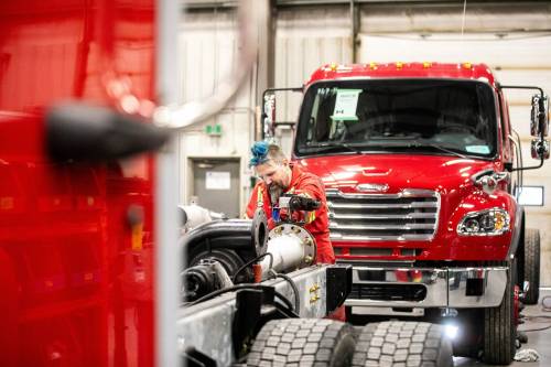 MIKAELA MACKENZIE / FREE PRESS
                                Bernard Pepper, lead mechanic, works on a rear mount pump assembly at Fort Garry Fire Trucks on Thursday.