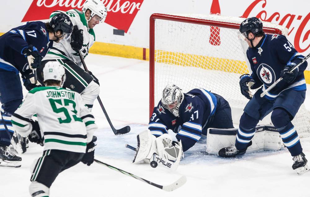 John Woods / THE CANADIAN PRESS
Jets goaltender Connor Hellebuyck needs six more victories to smash his own franchise record for wins in a single season, and he’s 10 away from setting a new NHL record.