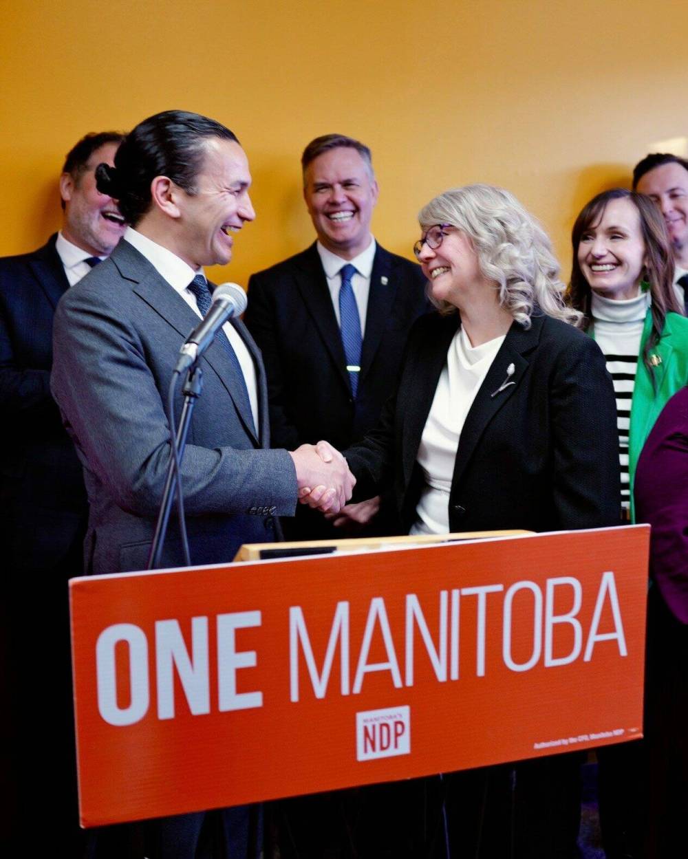 NDP candidate Shannon Corbett, shaking hands with Premier Wab Kinew, is vying for the Transcona seat in the byelection. (Supplied)