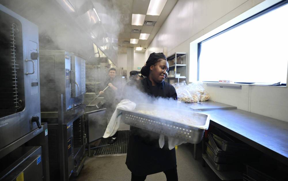 Ruth Bonneville / Free Press
Judith Eboiziegbe preps potatoes for hash browns.