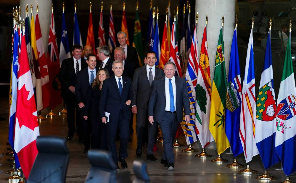 SEAN KILPATRICK / THE CANADIAN PRESS
Premier Wab Kinew (second from right) and Canada’s other provincial and territorial leaders met with Prime Minister Mark Carney (front left) in Ottawa to discuss trade issues.