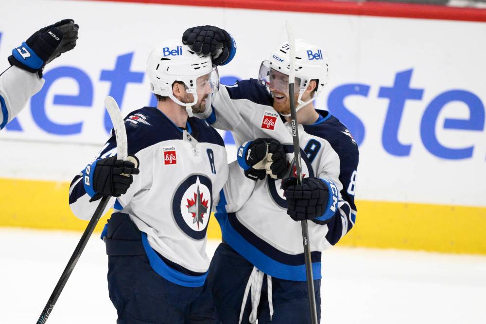NICK WASS / THE ASSOCIATED PRESS FILES
Winnipeg Jets defenceman Josh Morrissey (left) celebrates his game-winning goal against the Washington Capitals with teammate Kyle Connor during overtime in February.