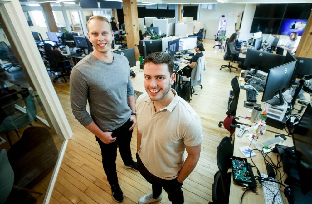 JOHN WOODS / FREE PRESS
Taiv co-founders Noah Palansky (right) and Jordan Davis in the company’s Winnipeg office. Taiv uses AI to customize in-house advertising on televisions in bars and restaurants.