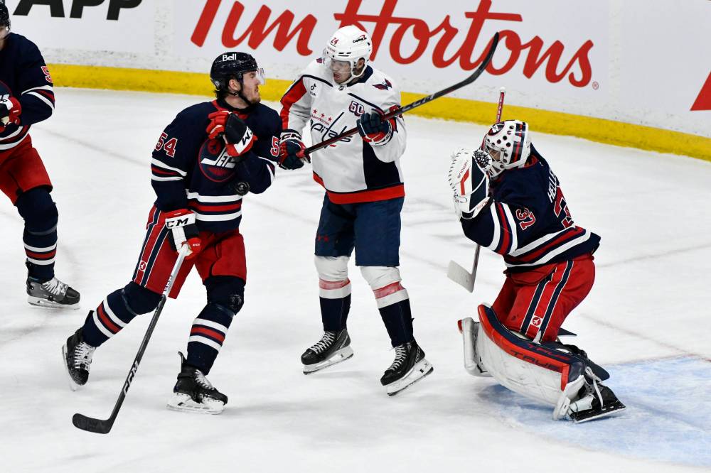 FRED GREENSLADE / THE CANADIAN PRESS
Winnipeg Jets’ Dylan Samberg (left) blocks a shot during the first period at Canada Life Centre Tuesday night. Samberg was a workhorse against the Capitals and made the pass to Nikolaj Ehlers, who scored the overtime goal.