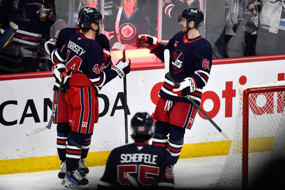 FRED GREENSLADE / THE CANADIAN PRESS
Winnipeg Jets’ Josh Morrissey (44) celebrates his goal against the Washington Capitals with his teammates at Canada Life Centre Tuesday night. Morrissey’s 12th of the season was the game-opener.