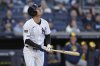 New York Yankees' Paul Goldschmidt looks up at his sacrifice fly during the seventh inning of a baseball game against the Milwaukee Brewers at Yankee Stadium, Thursday, March 27, 2025, in New York. (AP Photo/Seth Wenig)