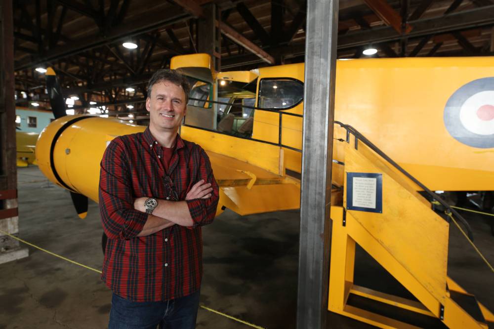 Commonwealth Air Training Plan Museum executive director Stephen Hayter stands beside a metal beam installed as part of emergency structural work done on the museum’s Second World War-era hangar. The museum is scheduled to reopen this Sunday after being closed for eight months. (Colin Slark/The Brandon Sun)