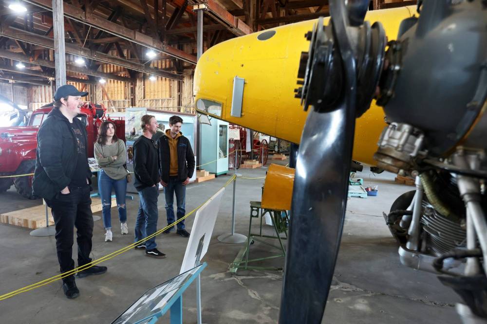 01042024 Andrew Hayter (from left) gives friends Mikayla Cox, Tyson Andrew and Jonas Kusmizkij a tour of the Commonwealth Air Training Plan Museum on Monday afternoon during a free open house for the grand reopening of the museum. The museum also celebrated the 100th anniversary of the Royal Canadian Air Force. Hayter’s father, Stephen Hayter, is the museum’s executive director. (Tim Smith/The Brandon Sun)