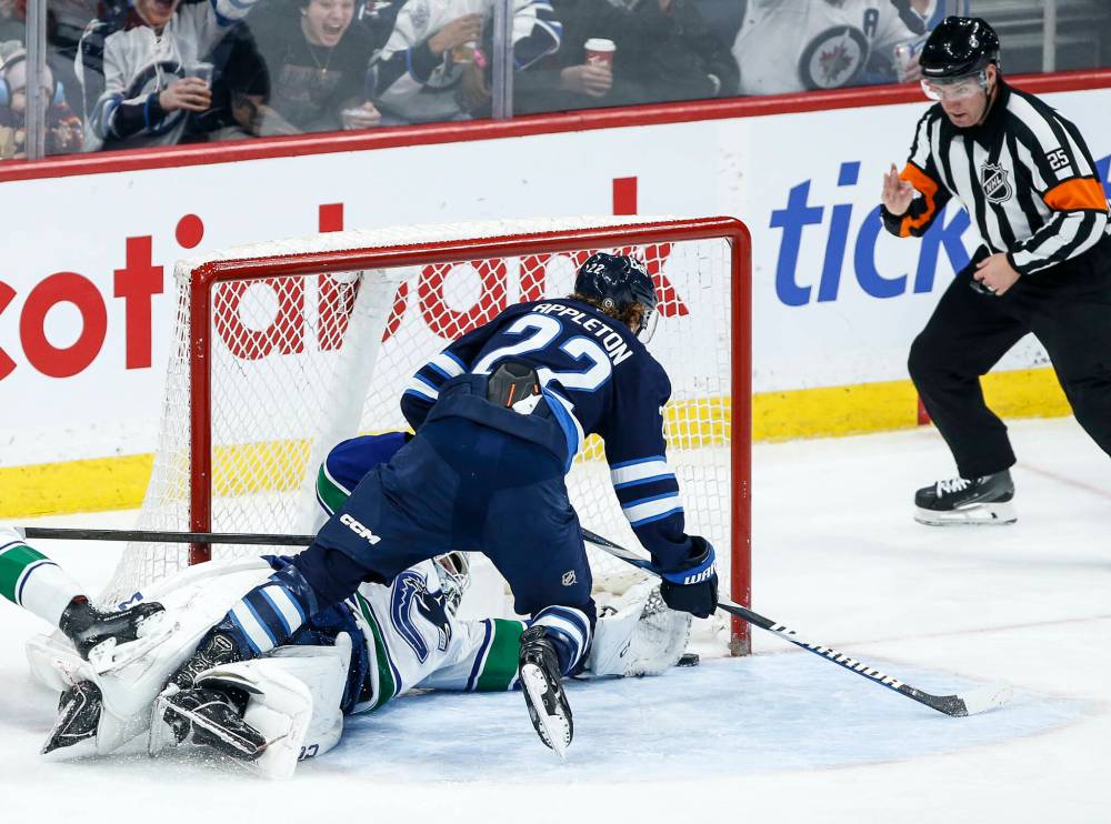 John Woods / THE CANADIAN PRESS
Winnipeg Jets’ Mason Appleton scores the game-winning goal on Vancouver Canucks’ goaltender Thatcher Demko in the third period at Canada Life Centre on Sunday.