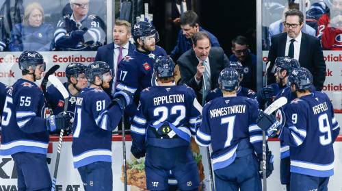 John Woods / THE CANADIAN PRESS FILES
                                Scott Arniel&rsquo;s (centre, pointing) ability to get his players to buy into his system is a testament to the job he&rsquo;s done so far this season.