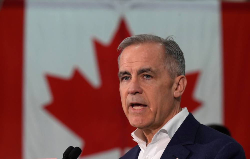 Liberal leader Mark Carney speaks during a campaign announcement at the College of Carpenters and Allied Trades in Toronto on Monday. (Adrian Wyld / The Canadian Press)