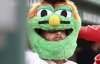 Boston Red Sox's Trevor Story wears a mascot head in the dugout after hitting a home run in the first inning of a baseball game against the St. Louis Cardinals, Friday, April 4, 2025, in Boston. (AP Photo/Mark Stockwell)