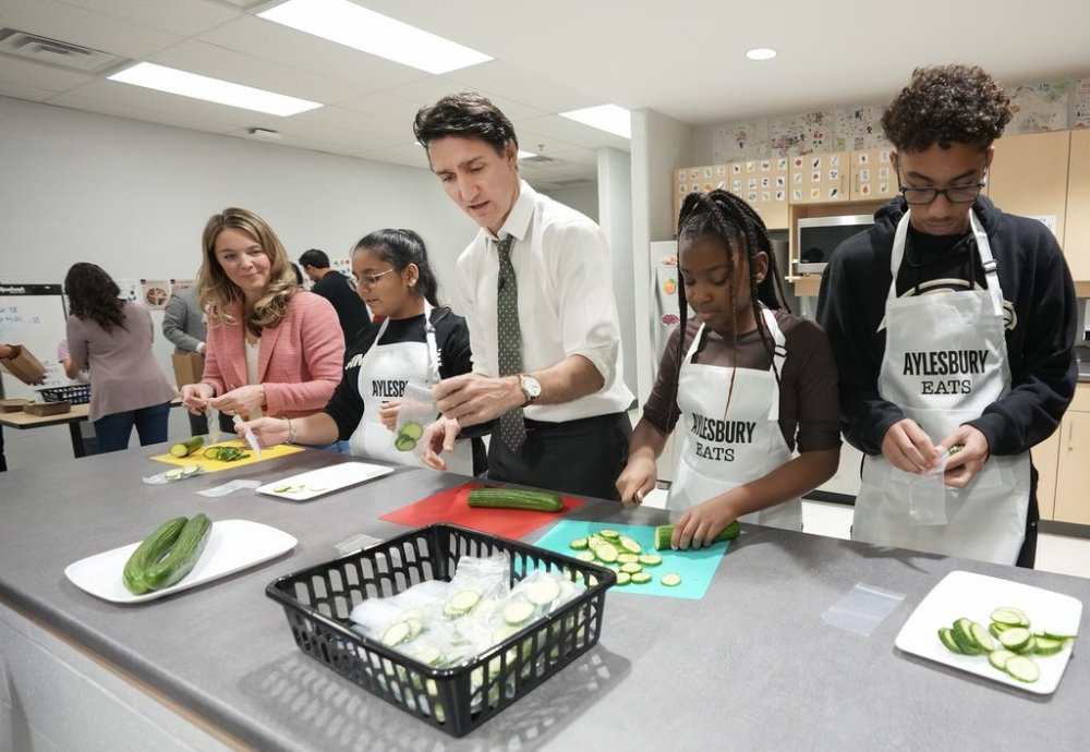 The Alberta and federal governments have ratified a $42-million agreement to expand meal programs for students. Prime Minister Justin Trudeau, centre, helps pack lunches as part of the school food program as he visits Aylesbury Public School in Brampton, Ont., on Friday, Nov. 22, 2024. THE CANADIAN PRESS/Nathan Denette