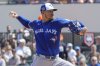 Toronto Blue Jays pitcher Jose Berríos throws against the Detroit Tigers in the first inning of a spring training baseball game, Monday, March 3, 2025, in Lakeland, Fla. (AP Photo/John Raoux)