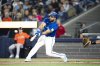 Blue Jays outfielder Anthony Santander (25) hits an RBI single against the Baltimore Orioles in the first inning of Toronto's 9-5 loss on Saturday, March 29, 2025. THE CANADIAN PRESS/Christopher Katsarov