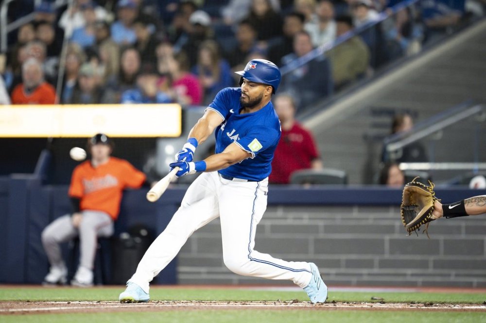 Blue Jays outfielder Anthony Santander (25) hits an RBI single against the Baltimore Orioles in the first inning of Toronto's 9-5 loss on Saturday, March 29, 2025. THE CANADIAN PRESS/Christopher Katsarov