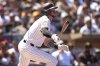 San Diego Padres' Jackson Merrill watches his two-RBI single during the first inning of an opening-day baseball game against the Atlanta Braves Thursday, March 27, 2025, in San Diego. (AP Photo/Gregory Bull)