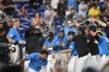 Miami Marlins players celebrate beating the Pittsburgh Pirates 3-2, Sunday, March 30, 2025, in Miami. (AP Photo/Michael Laughlin)