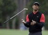 FILE - Tiger Woods flips his club after his shot to the 10th green during the final round of The Players Championship golf tournament Sunday, March 17, 2019, in Ponte Vedra Beach, Fla. (AP Photo/Lynne Sladky, File)