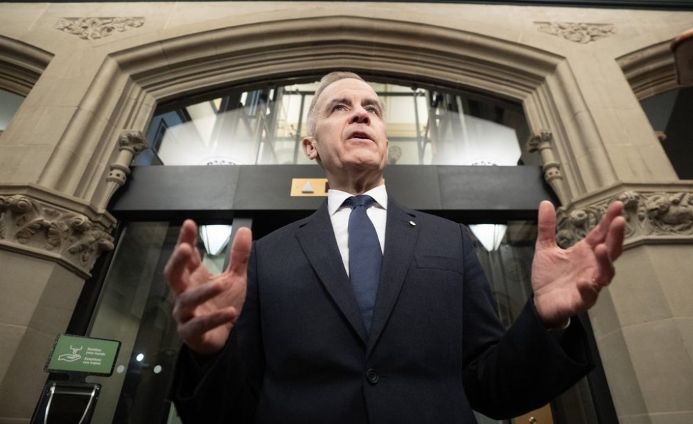 Prime Minister Mark Carney speaks with media before chairing a meeting of the Cabinet Committee on Canada-U. S. Relations and National Security on Parliament Hill, Wednesday, April 2, 2025 in Ottawa. THE CANADIAN PRESS/Adrian Wyld
