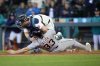 Detroit Tigers' Colt Keith is forced out at home by Seattle Mariners catcher Mitch Garver on a bases loaded hit during the ninth inning in a baseball game, Wednesday, April 2, 2025, in Seattle. (AP Photo/John Froschauer)