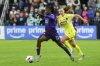 FILE - Orlando Pride forward Barbra Banda (22) runs past Washington Spirit defender Tara McKeown (9) during the second half of the NWSL championship at CPKC Stadium, Saturday, November 23, 2024, in Kansas City, Mo. (AP Photo/Reed Hoffmann, File)