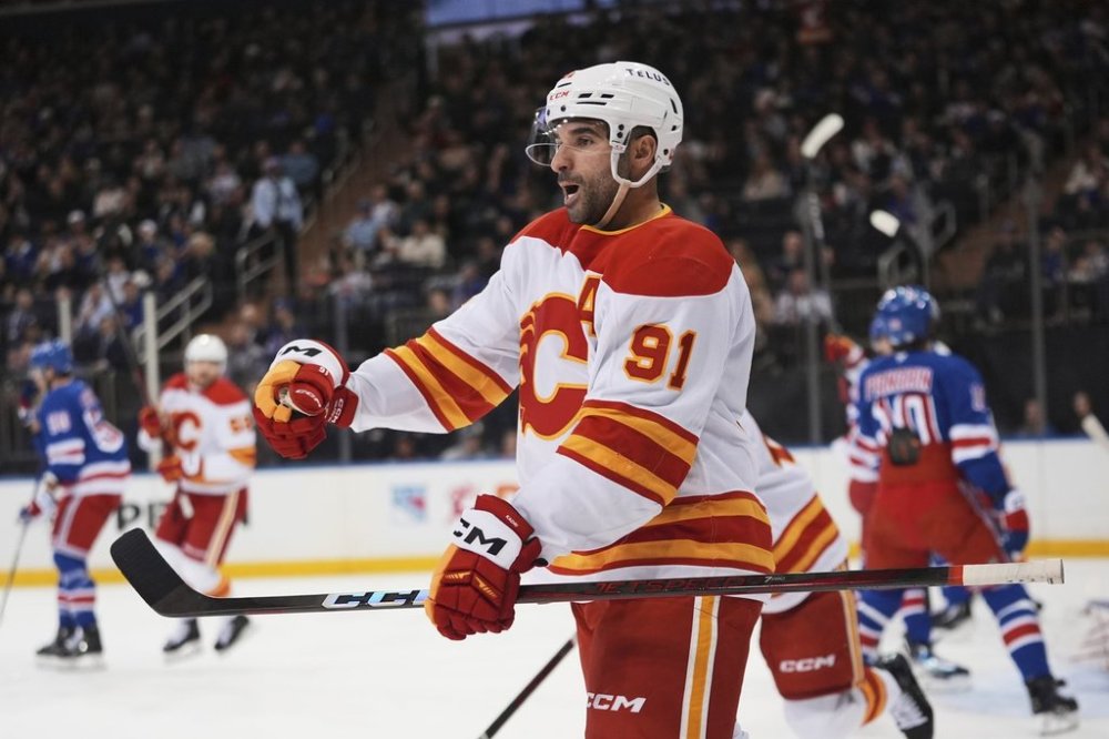Calgary Flames' Nazem Kadri (91) celebrates after scoring a goal during the first period of an NHL hockey game against the New York Rangers Tuesday, March 18, 2025, in New York. (AP Photo/Frank Franklin II)