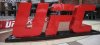 FILE - A UFC logo stands outside the arena, April 24, 2021, in Jacksonville, Fla. (AP Photo/Gary McCullough, file)