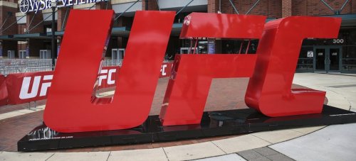 FILE - A UFC logo stands outside the arena, April 24, 2021, in Jacksonville, Fla. (AP Photo/Gary McCullough, file)