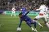 France's Michael Olise, left, and Croatia's Duje Caleta-Car vie for the ball during the UEFA Nations League quarterfinal second leg soccer match between France and Croatia, at the Stade de France in Saint-Denis, outside Paris, Sunday, March 23, 2025. (AP Photo/Thibault Camus)