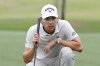 Min Woo Lee looks over the eighth green before putting in the first round of the Houston Open golf tournament, Thursday, March 27, 2025, in Houston. (AP Photo/Michael Wyke)