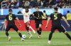 Canada's Alphonso Davies, second from left, vies for the ball against Mexico's Erik Lira, left, and Mexico's Israel Reyes, second from right, during the first half of a CONCACAF Nations League semifinal soccer match Thursday, March 20, 2025, in Inglewood, Calif. (AP Photo/Etienne Laurent)
