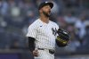 New York Yankees pitcher Devin Williams reacts during the ninth inning of a baseball game against the Milwaukee Brewers at Yankee Stadium, Thursday, March 27, 2025, in New York. (AP Photo/Seth Wenig)