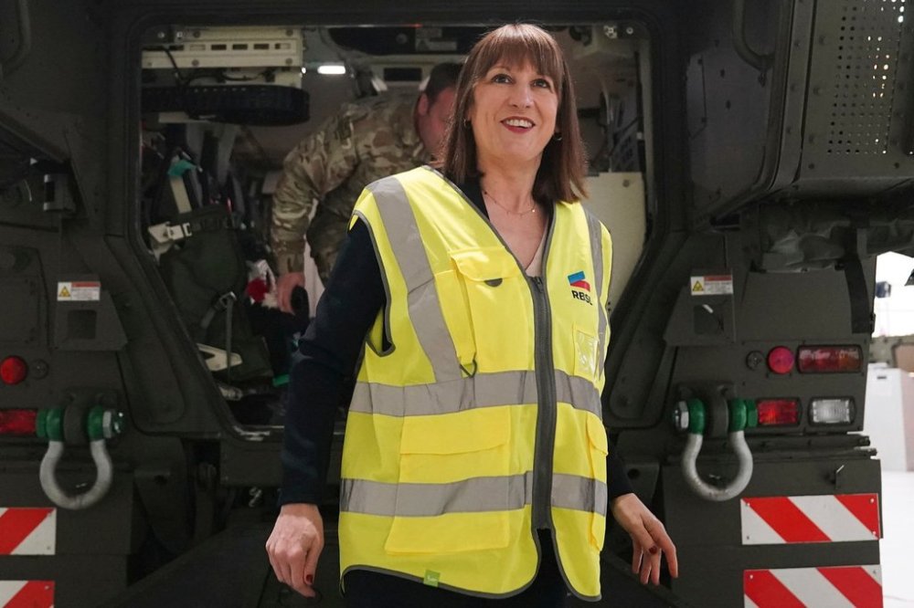 Britain's Chancellor of the Exchequer Rachel Reeves is shown a military vehicle during a visit to Rheinmetall BAE Systems Land (RBSL) in Telford, England, Monday March 24, 2025. (Jacob King/Pool via AP)